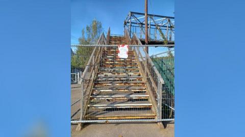 The fenced off pedestrian footbridge at South Bank railway station. 