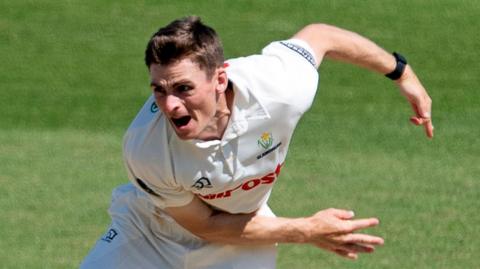Andy Gorvin in bowling action for Glamorgan