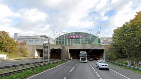 The Hatfield Tunnel, showing cars on the A1(M) and The Galleria shopping centre above the tunnel