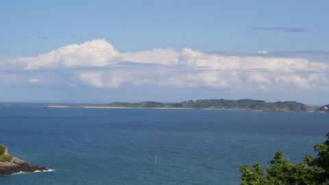 Guernsey sea views with other islands in background.