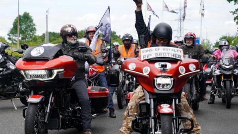 Hairy Biker Si King (L) at the National Motorcycle Museum in Solihull, as he and thousands of others ride on motorbikes from London to Barrow. They are clad in biking gear and helmets.