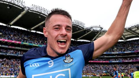 Brian Howard holds the Sam Maguire Trophy aloft