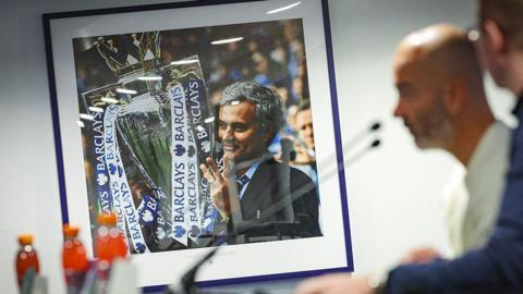 Enzo Maresca in the Drake Suite with a giant Mourinho photo in the background