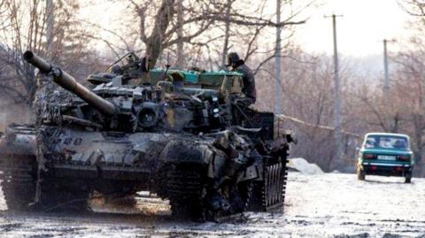 Tank and car in Donetsk