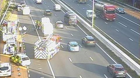 Traffic camera pictures showing a number of damaged vehicles on the hard shoulder of the M4 near Bristol, with emergency service vehicles on the scene. 