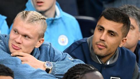 Manchester City's Erling Haaland and Rodri (right)