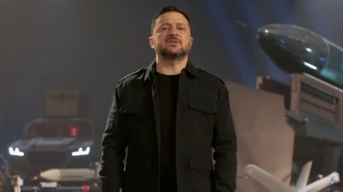 Ukraine President Zelensky in front of robots and drones