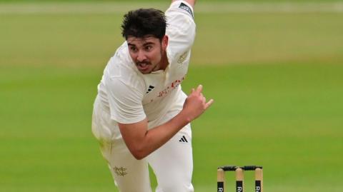Josh Tongue bowling for Notts
