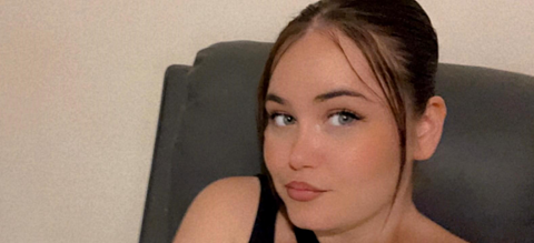 A selfie-style image of Courtney Mitchell. She is looking directly into the camera