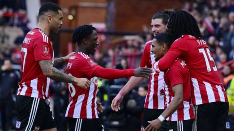 Exeter City celebrate scoring against Oxford United