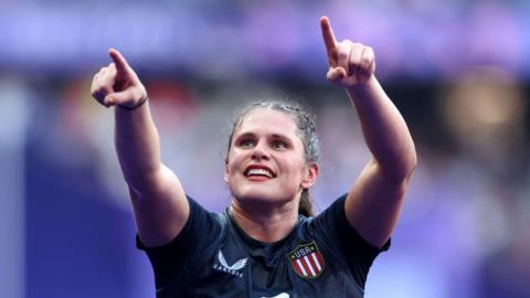 Ilona Maher at the Olympic Games wearing a navy USA jersey