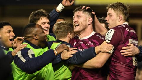 Sale players celebrate a try that was later disallowed