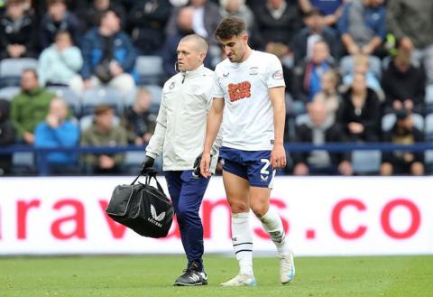 Pol Valentin looking down at the ground in disappointment after being substituted off with an injury.