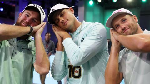 Shane Lowry, Ludvig Aberg and Wyndham Clark celebrate winning their first TGL match by pretending to go to sleep