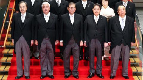 Crop of a picture of Japan's new cabinet, which the government said has been manipulated to make its members look less 'unkempt'