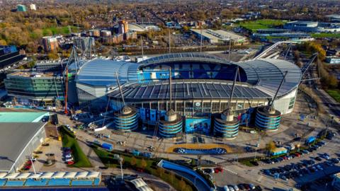 Drone view of the Etihad campus in east Manchester with Manchester City's stadium in the centre.