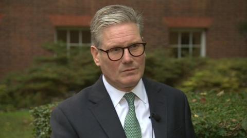 The Prime Minister Keir Starmer standing in the garden at Downing Street