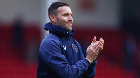 Walsall head coach Mat Sadler clapping his hands