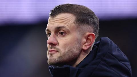 Luton boss Jack Wilshere staring ahead looking non-plused 