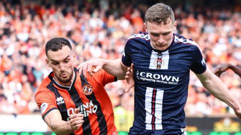 Dundee United's Vicko Sevelj and Dundee's Ethan Hamilton