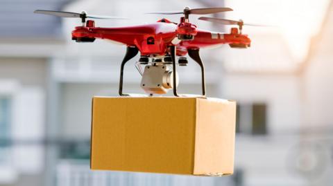 an image of a drone with its propellers whirling around in the air