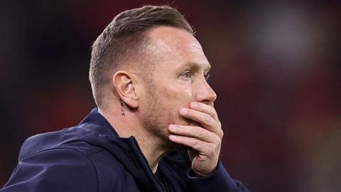 Craig Bellamy looks on during a Wales game