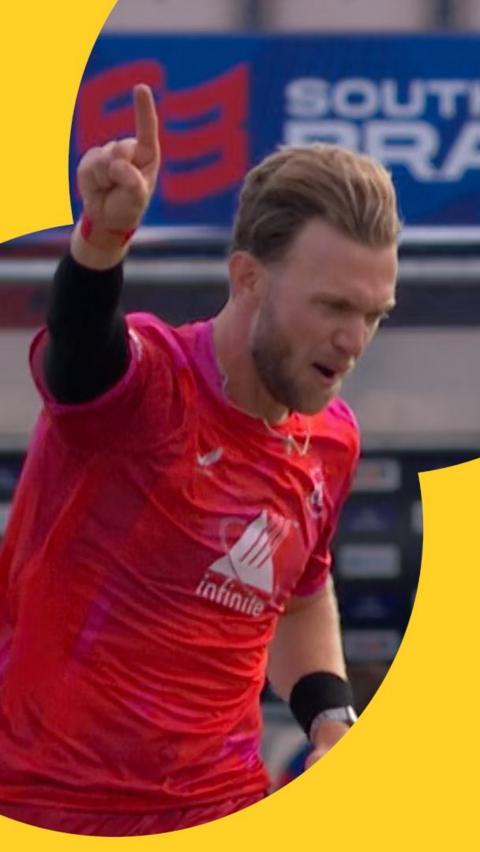 Sam Cook celebrates after bowling Jamie Smith
