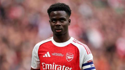 Bukayo Saka of Arsenal looks on