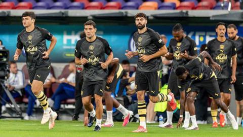 Manchester City players warm up