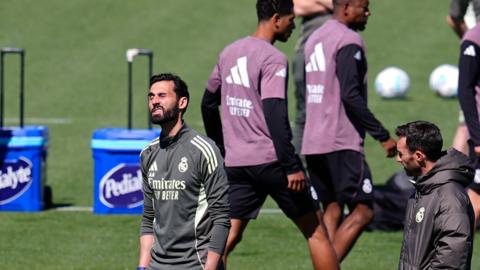 Alvaro Arbeloa during Real Madrid training with players including Jude Bellingham in the background