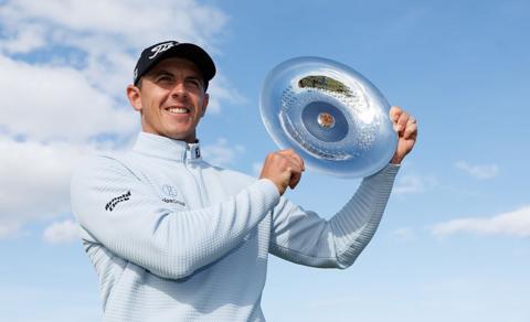 Grant Forrest of Scotland poses for a photograph with Nexo Championship 2025 trophy following the final round at Trump International Golf Links on 10 August 2025 in Balmedie, Scotland
