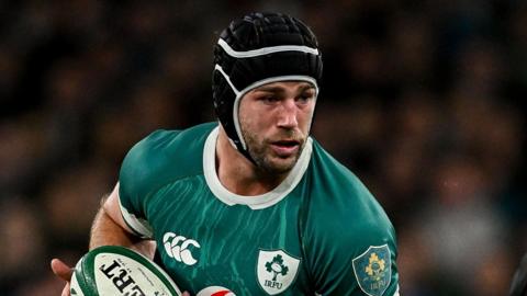 Caelan Doris runs with the ball during Ireland's loss to the All Blacks