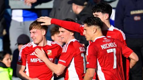 Swindon players celebrate Joe Snowdon's opening goal at Bristol Rovers