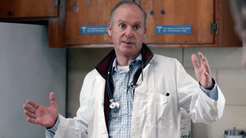 Michael Keaton playing the role of a doctor in a white coat