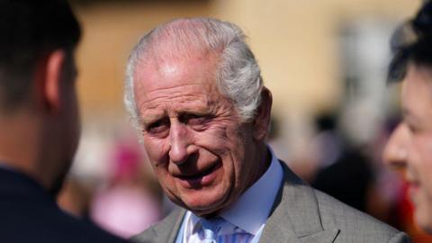 King Charles in the garden of Buckingham Palace