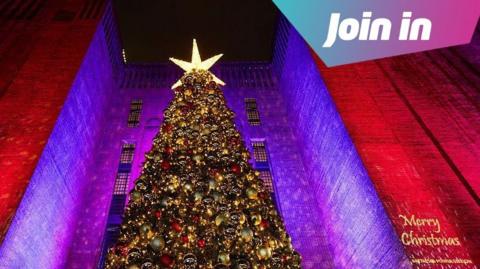 View looking up to a large Christmas tree at Battersea Power Station