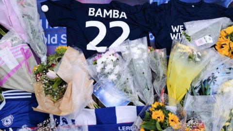 Shirt and flowers left at Cardiff City Stadium in tribute to Sol Bamba