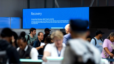 An airport screen displays an error message rather than flight information