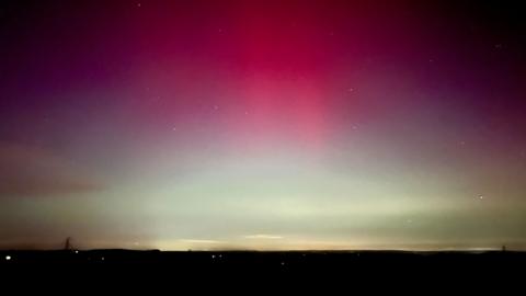 A red and white night sky. 