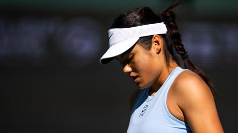 Emma Raducanu looks down to the court during her Indian Wells first round match