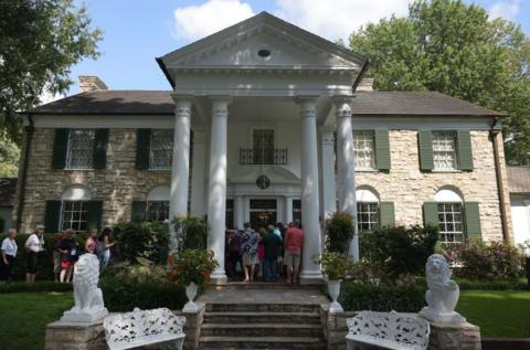 People stand outside Graceland