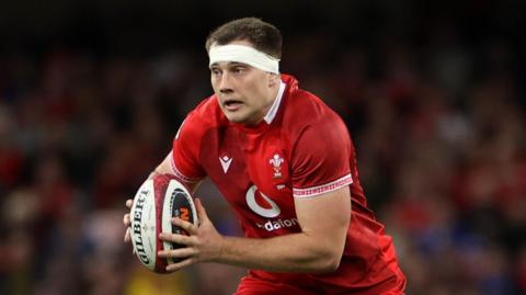 Ben Carter carries the ball for Wales