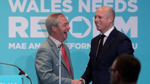 Nigel Farage and Dan Thomas shaking hands