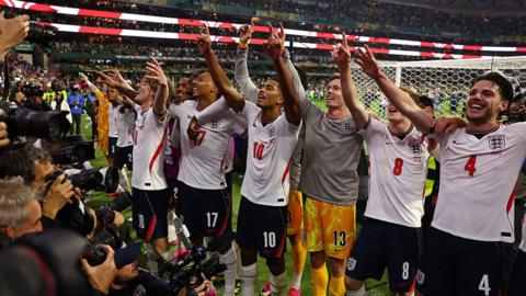 Jude Bellingham, Anthony Gordon & Declan Rice of England celebrate with team-mates at the end of the FIFA World Cup 2026 Round of 16 match between Mexico and England at Mexico City Stadium.