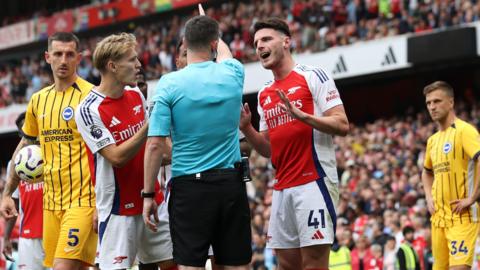 Declan Rice is sent off by referee Chris Kavanagh