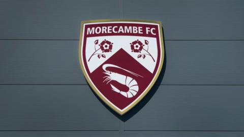Morecambe's crest on their Mazuma Stadium home