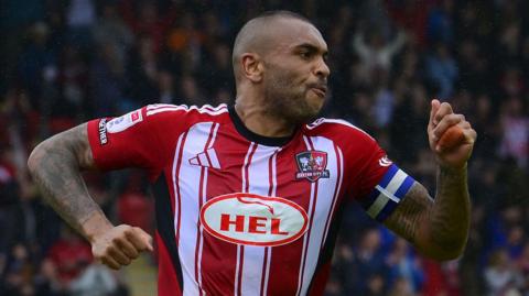 Josh Magennis celebrates scoring for Exeter City