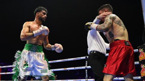 Referee stops the fight between Adam Azim and Steve Claggett