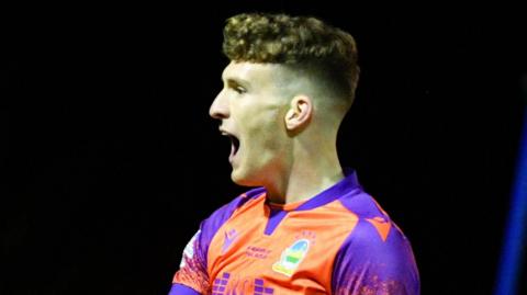 Charlie Allen celebrates scoring Linfield's third goal