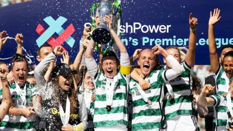 Celtic players celebrate their title win
